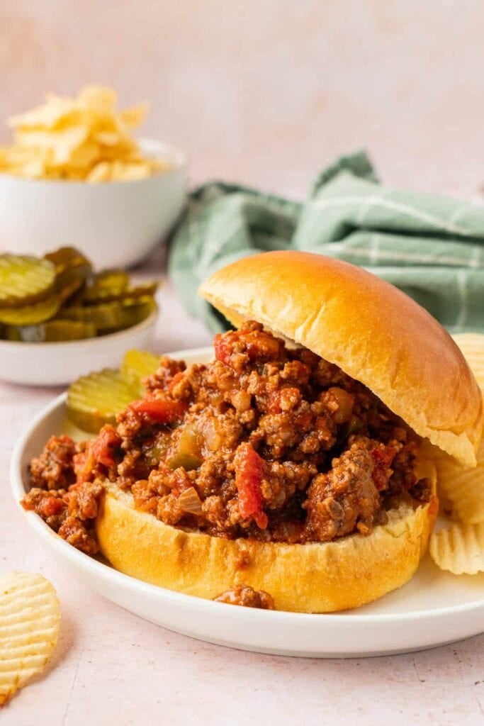 Crockpot sloppy joes with chips on a plate