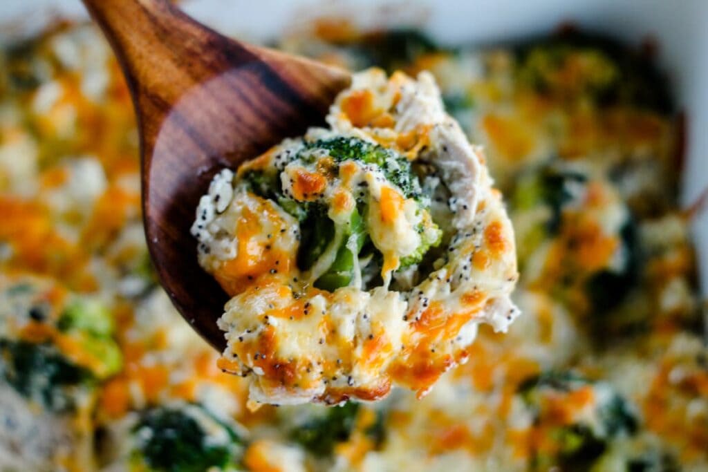 Everything bagel chicken casserole on a wooden spoon.