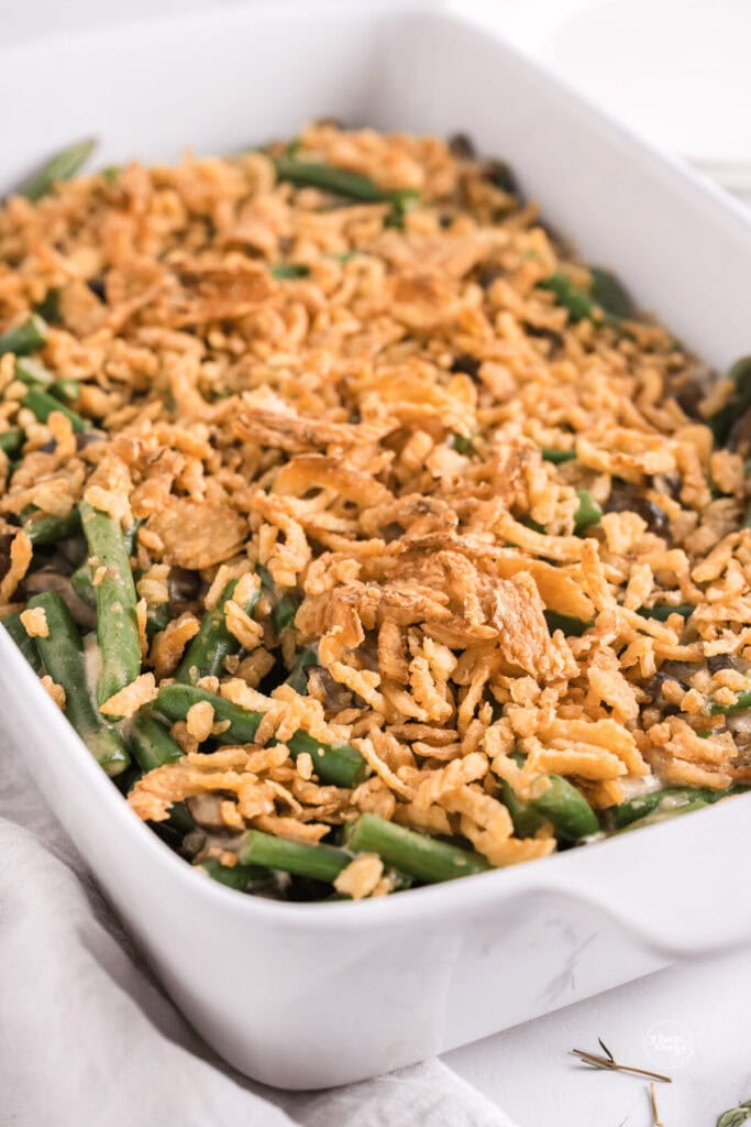 Green bean casserole with Worcestershire in a baking dish.