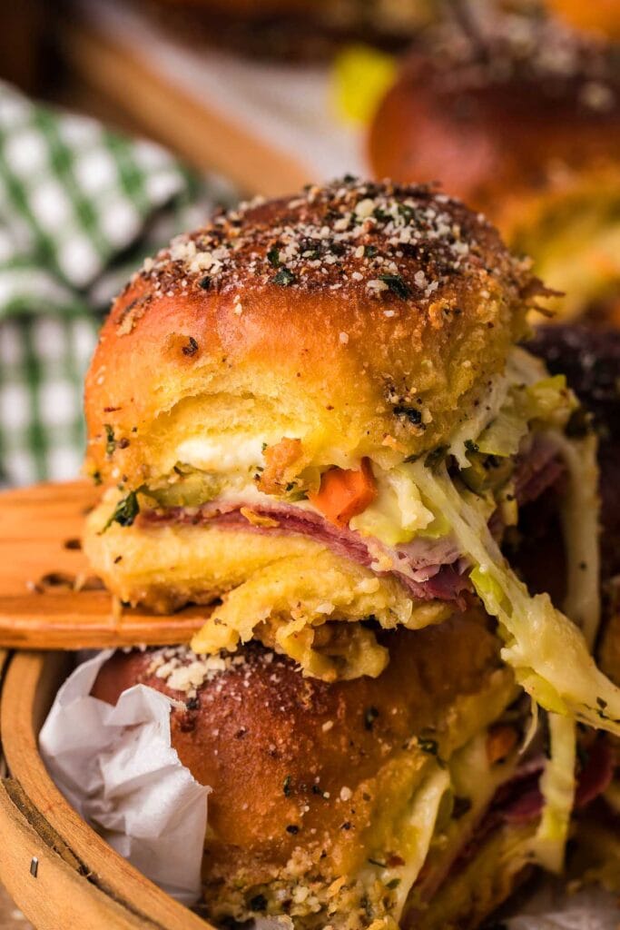 Hot Italian slider on a wooden spatula.