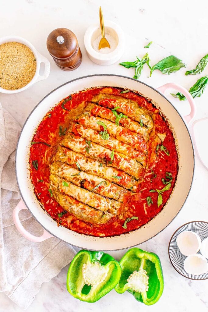 Italian meatloaf with tomato sauce in a pot.