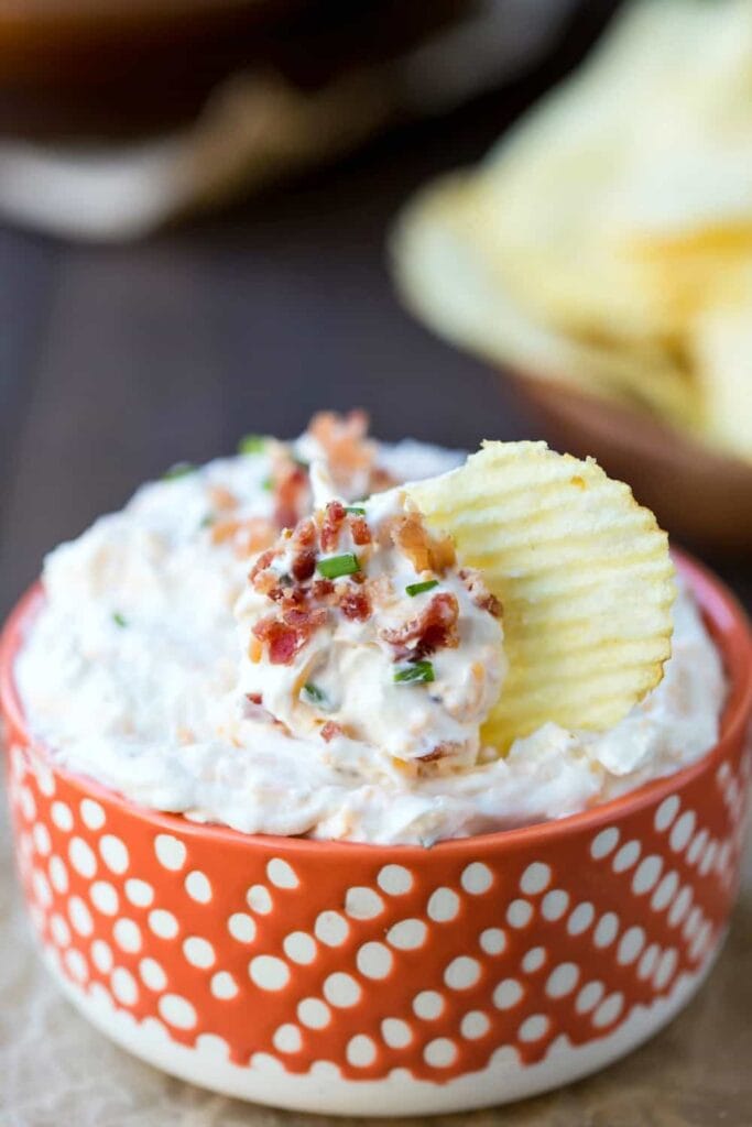 Loaded sour cream dip in a bowl.