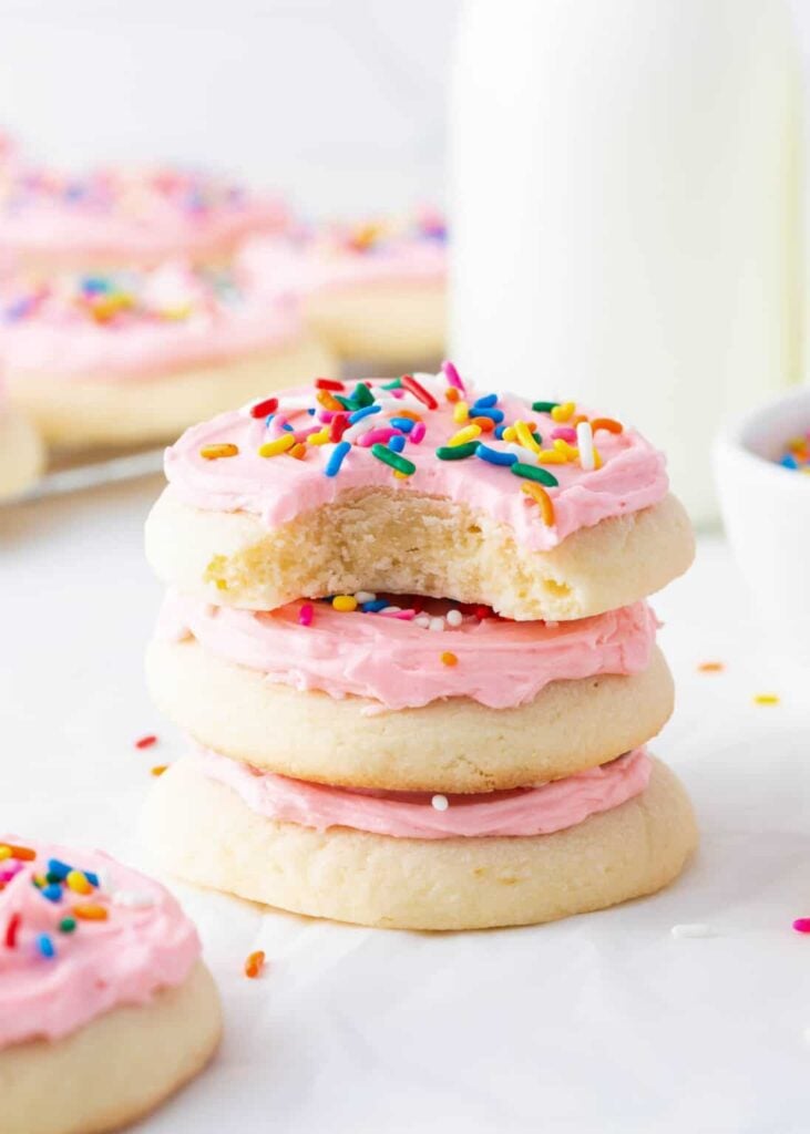 Stack of Lofthouse cookies with frosting and sprinkles.