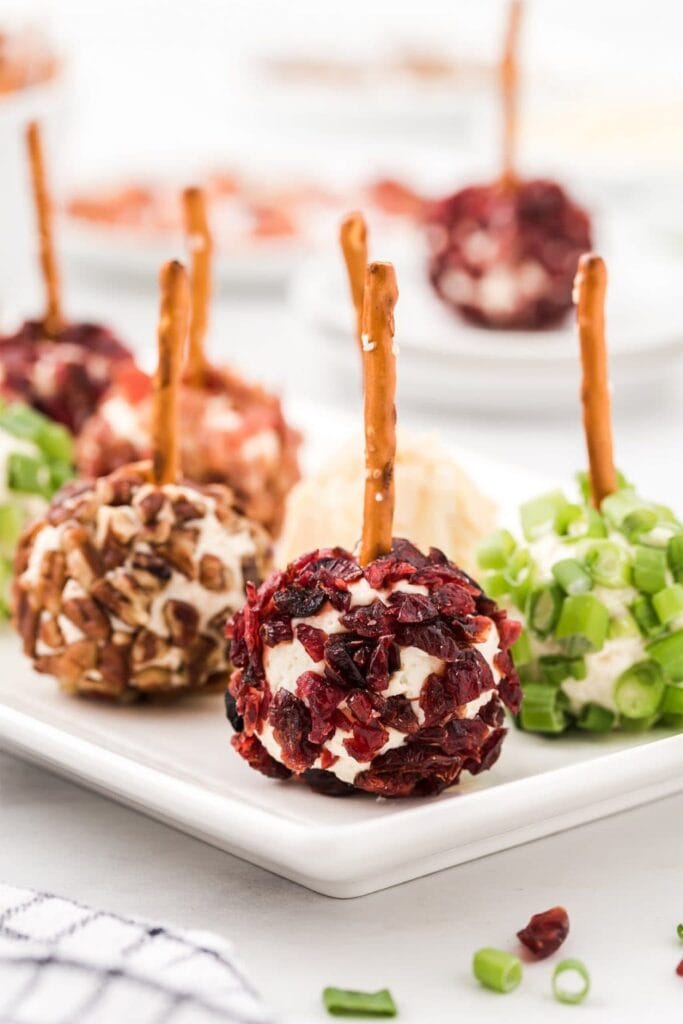 Mini cheese ball bites on a plate.
