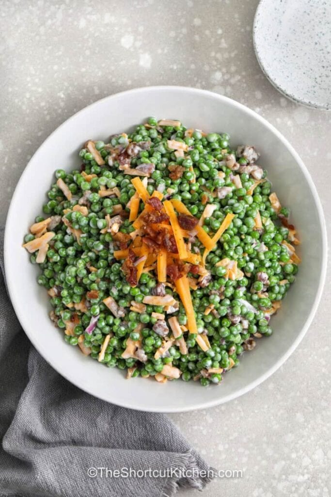 Pea salad with bacon in a bowl.