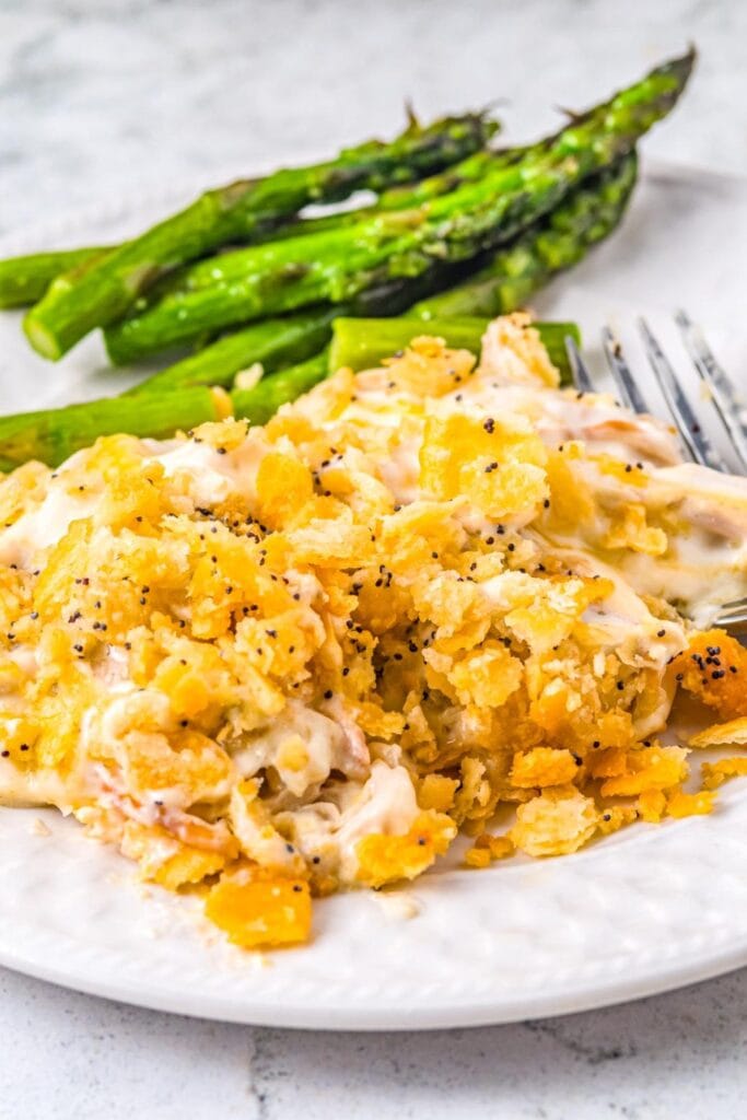 Poppy seed chicken casserole with green beans on a plate.