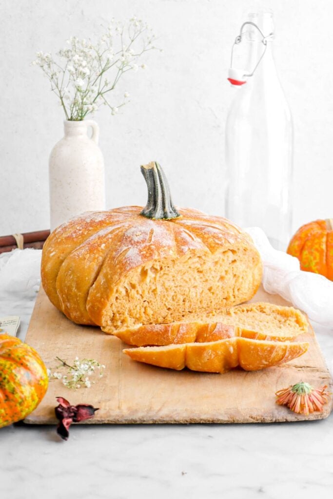 Pumpkin sourdough bread on a wooden board.