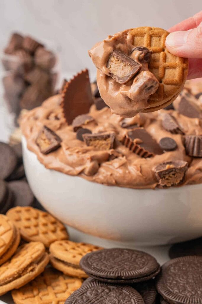 Creamy Reese’s fluff with peanut butter and chocolate pieces in a bowl.