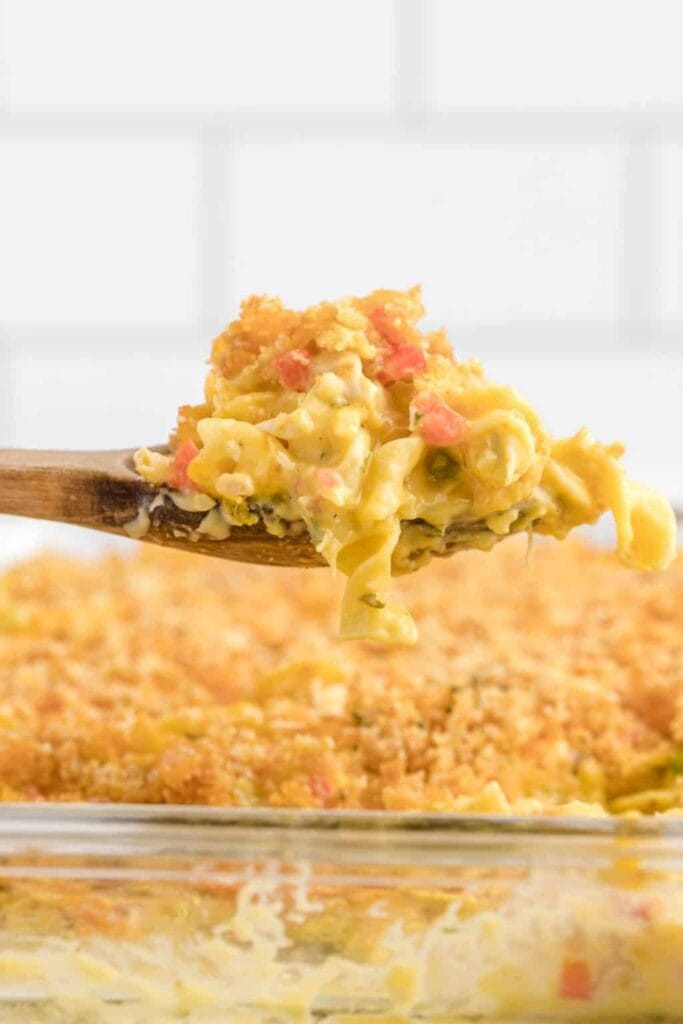 Close-up of Ritz chicken casserole on a wooden spoon.