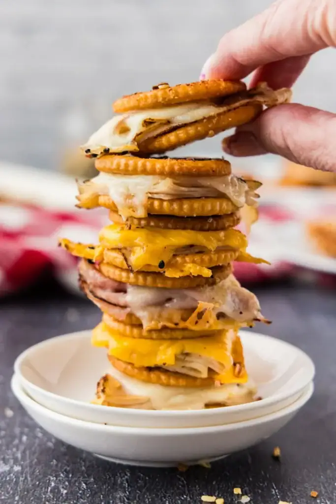 Stack of Ritz cracker party sandwiches.