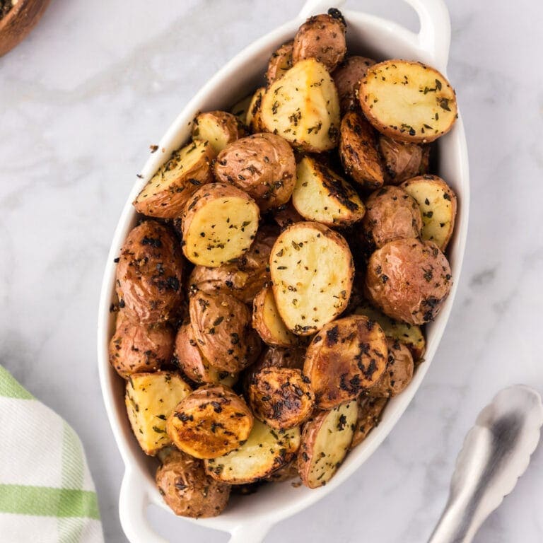 Roasted red potatoes in a serving dish.