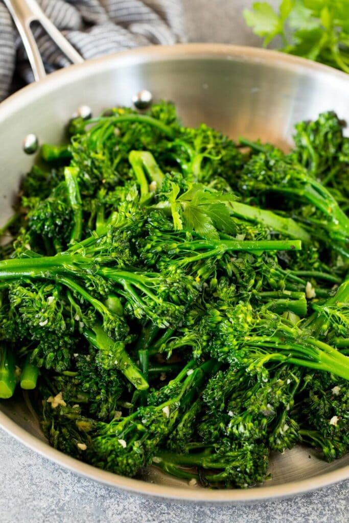Sauteed broccolini in a skillet.