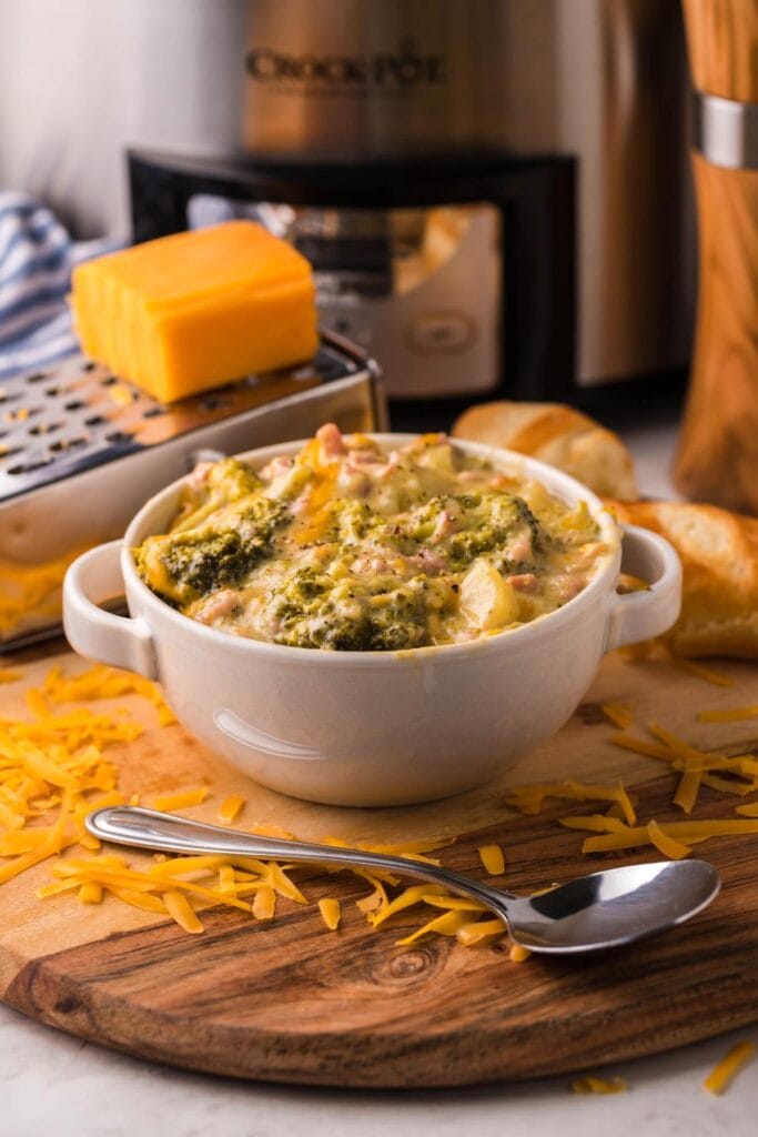Slow cooker ham, potato, cheese, and broccoli soup in a bowl.