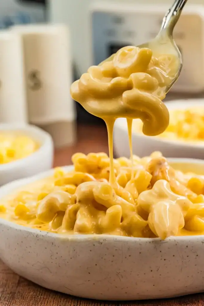 Slow cooker mac and cheese with Velveeta in a bowl.