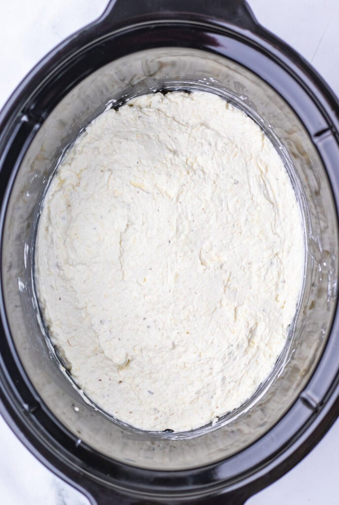 Cream cheese mixture in a slow cooker.