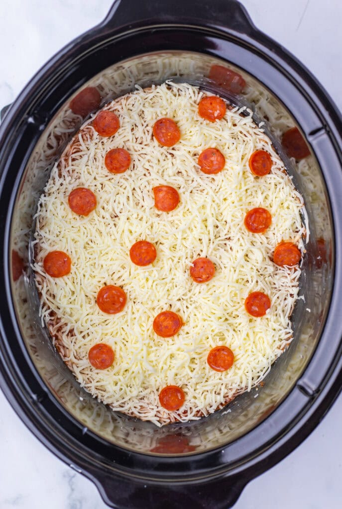 Pizza dip topped with mozzarella and pepperoni.
