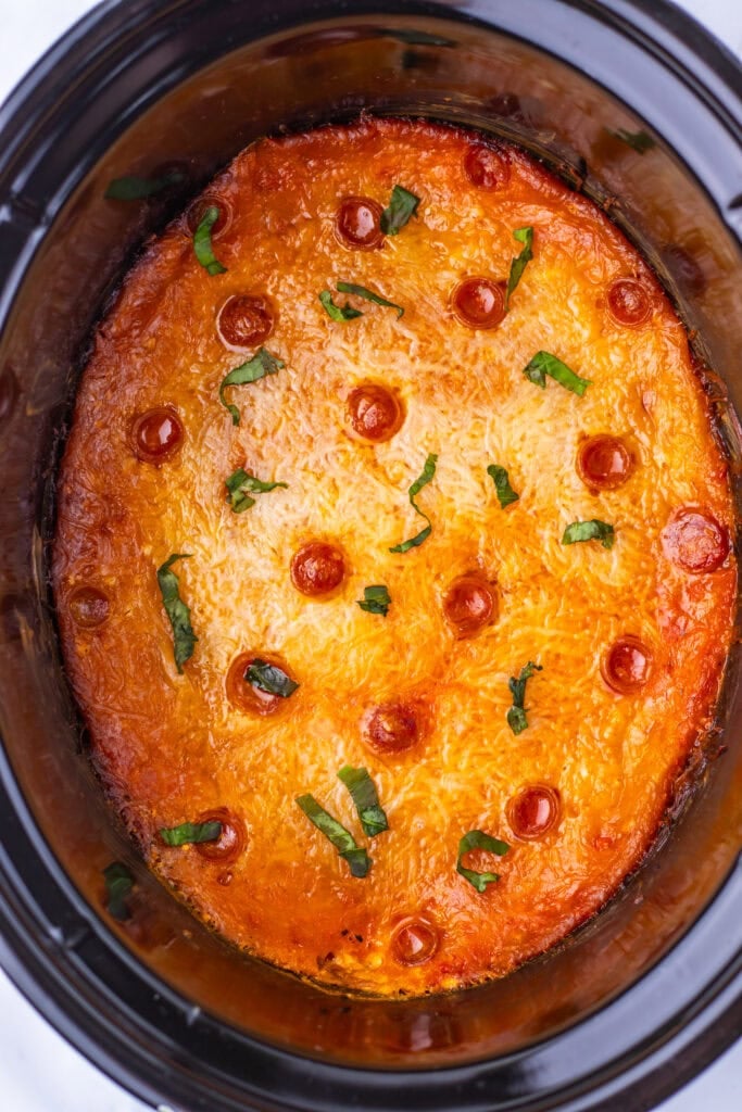 Finished pizza dip with melted cheese and pepperoni.