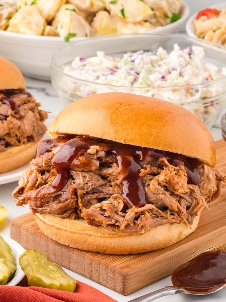 Slow cooker pulled pork sandwich with barbecue sauce.