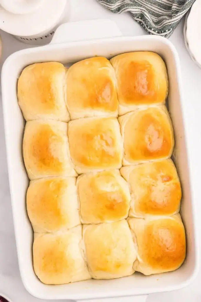Sourdough discard rolls in a baking dish.