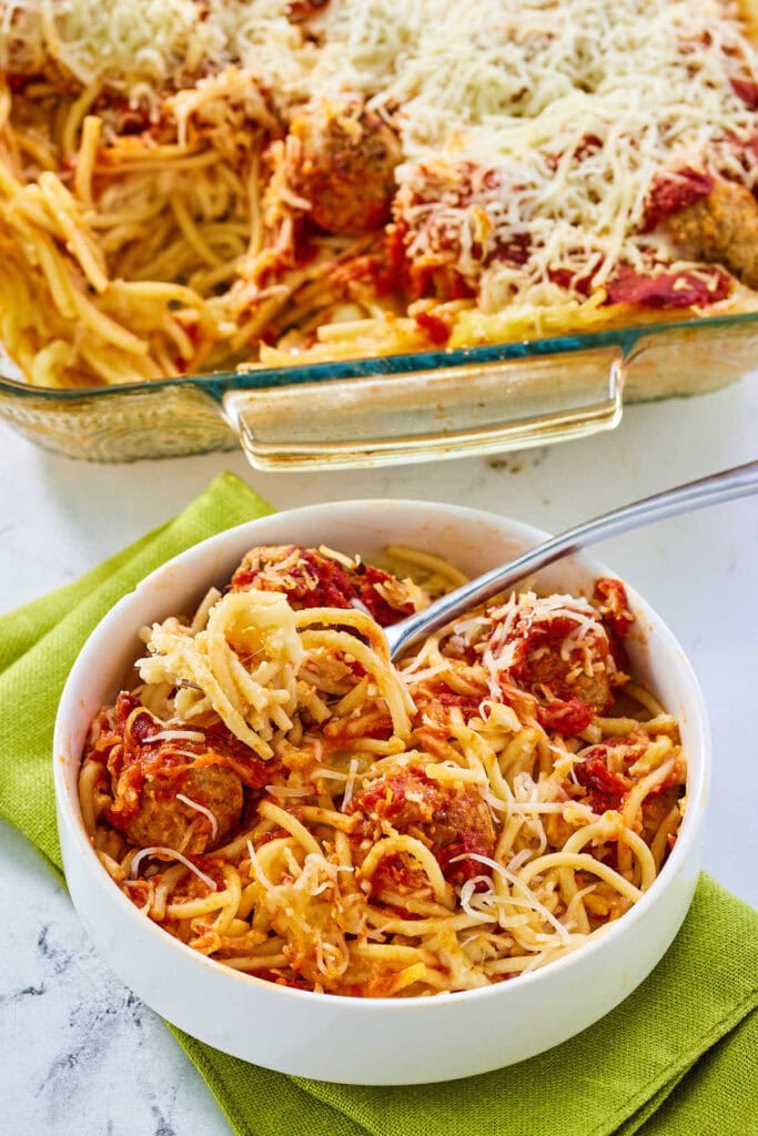 Spaghetti and meatball casserole in a bowl.