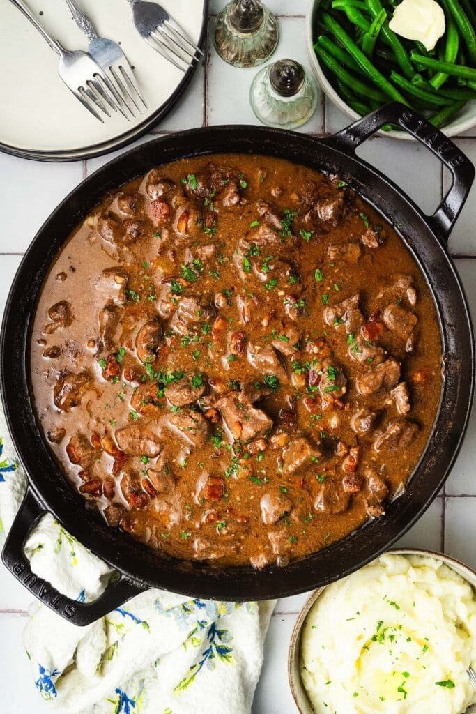 Beef tips in a skillet.