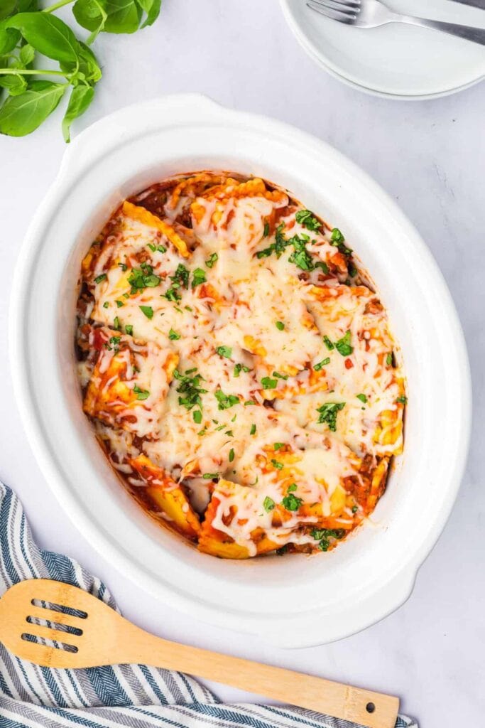 Cheesy crockpot ravioli lasagna in a slow cooker.