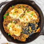 French onion chicken and rice bake in a skillet.