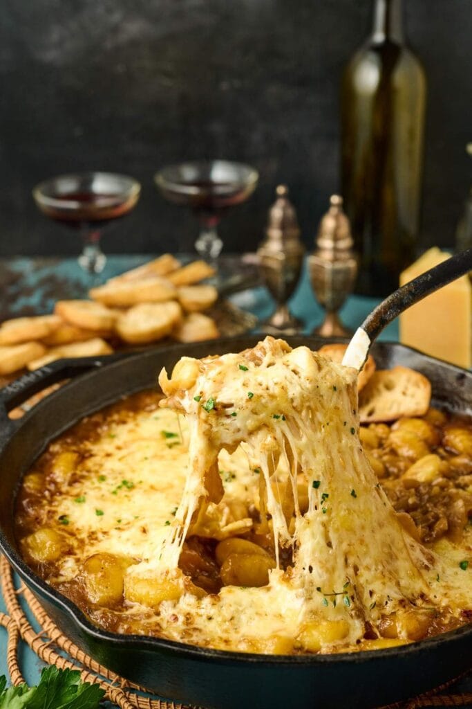French onion gnocchi in a skillet.
