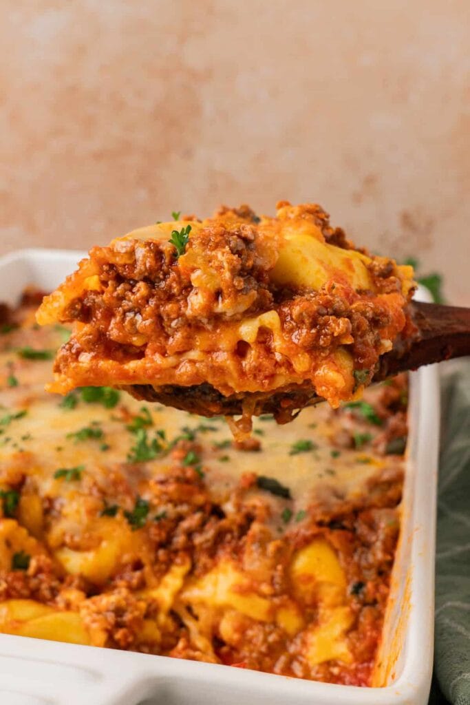 Ravioli lasagna on a serving spoon.