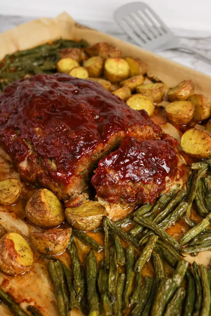 Sheet pan meatloaf with potatoes and green beans.