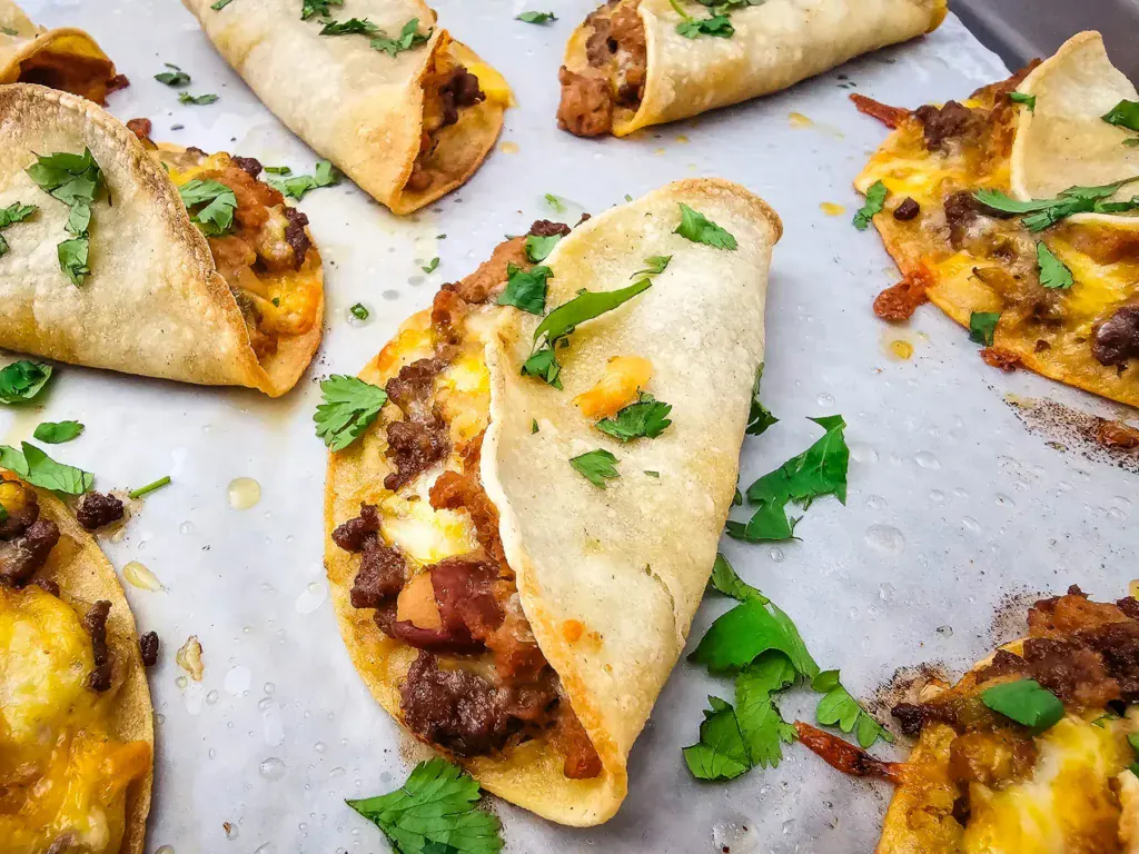 Sheet pan tacos with ground beef and cheese.