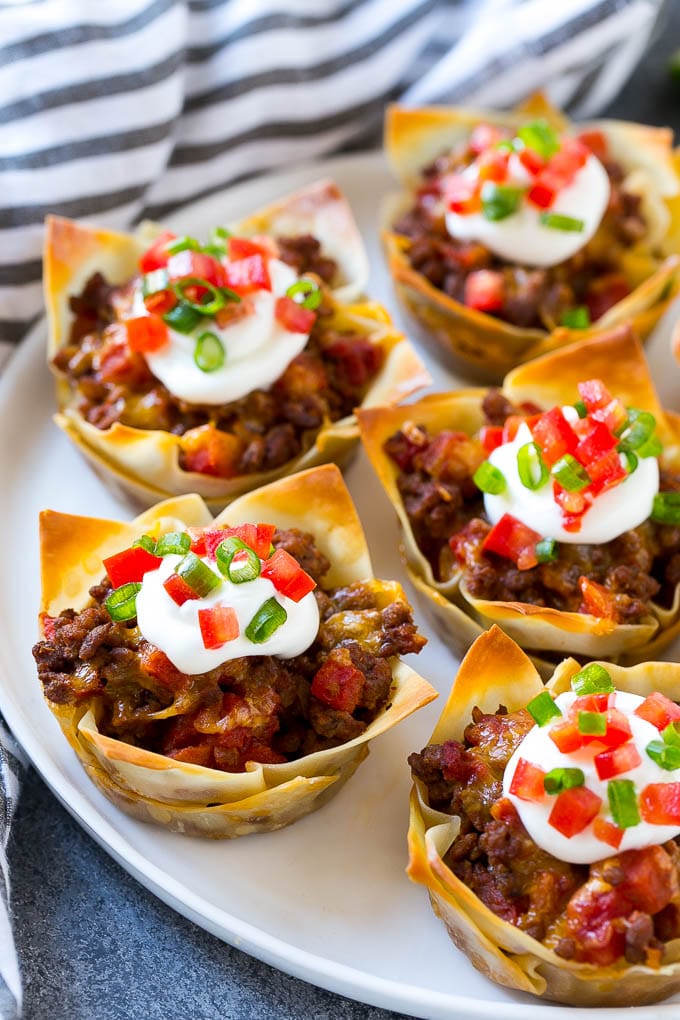 Taco cups beef and cheese on a plate.